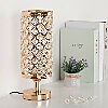 Unlit vintage gold and crystal table lamp.