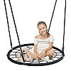 Spiderweb swing with a young girl sitting on it.