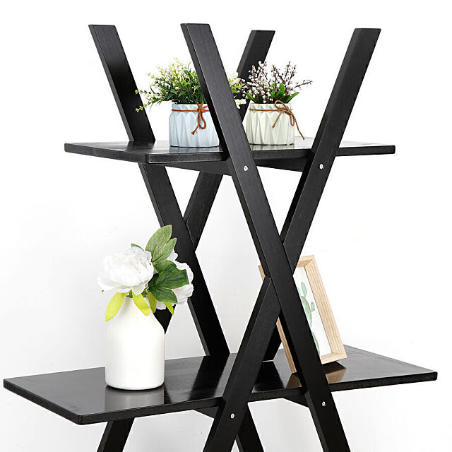 Top 2 shelves of the A-frame ladder shelf with items on display.