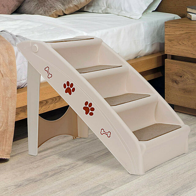 Pet Stairs up next to a bed. 