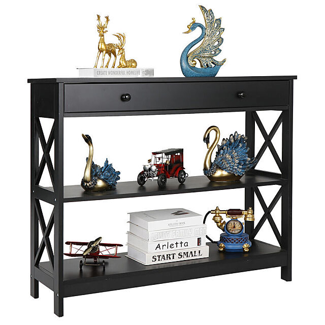 Sofa table with display items on the shelves and tabletop.