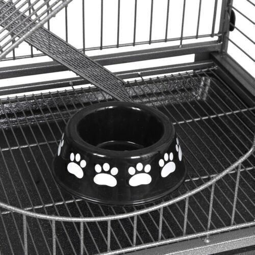 View of the bottom of the cage with a food bowl. 